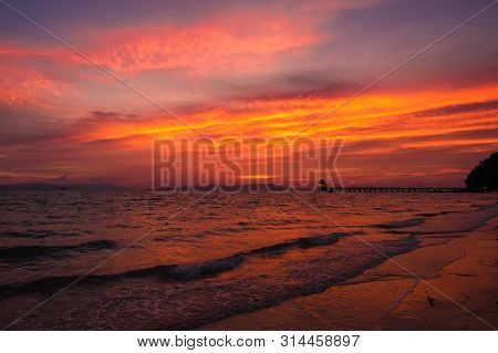 View Of Beautiful Sky Of Sea And Wave That Are Breaking Into The Beach And  Reflection Of The Sky At