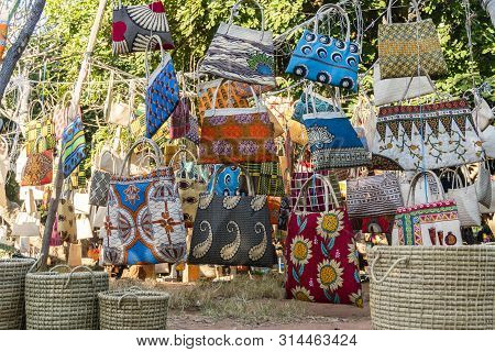Traditional African Market Selling Colorful  Bags Hanged On Trees, Maputo, Mozambique