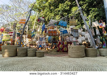 Traditional African Market Selling Colorful  Bags Hanged On Trees, Maputo, Mozambique