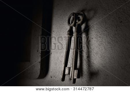 Old Rusted Keys Hanging On The Wall
