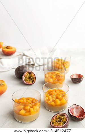 Caramel Panna Cotta, Custard Pudding With Peach And Passion Fruit, White Table, Copy Space