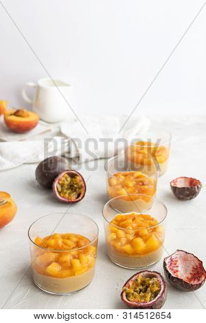 Caramel Panna Cotta, Custard Pudding With Peach And Passion Fruit, White Table, Copy Space