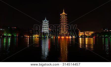 The Sun And Moon Twin Pagodas During Evening. View Of Shanhu Lake (fir Lake) In Downtown Of Guilin, 