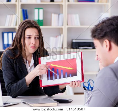 Business meeting between businessman and businesswoman