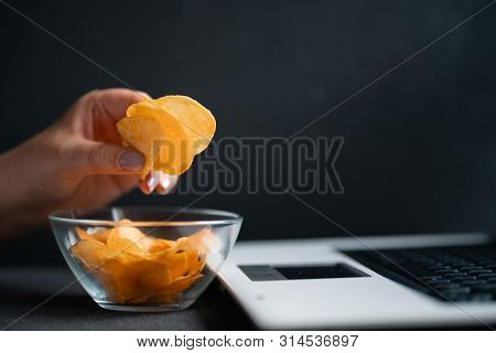 Compulsive Overeating, Mindless Snacking, Junk Food, Unhealthy Meals. Woman Eating Chips From Bowl A