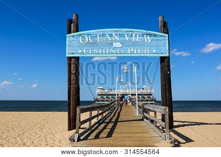 Norfolk, Virginia/usa - July 22, 2019:  Entrance Sign For The Ocean View Fishing Pier, With The Rest