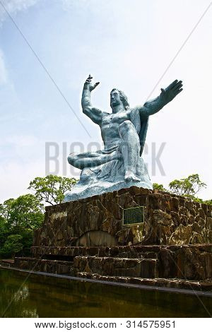 Nagasaki, Japan - 25 May 2013, Peace Park With Peace Statue. The Statue Is Commemorating The Atomic 
