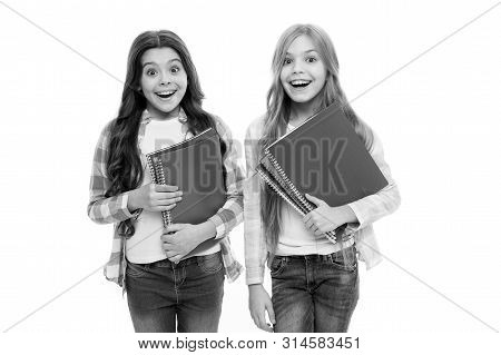 Back To School Books To Share. Little School Children Holding Note Books. Adorable Small Girls With 