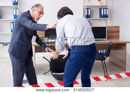 Forensic investigator investigating theft in the office