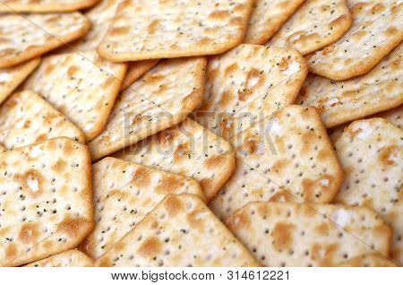 Tuc Original Snack Crackers Lies On Market Table Stacked In Big Pile