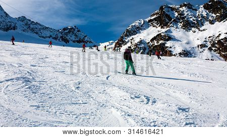 Stubai, Austria - November 1, 2011: Snowboarders And Skiers Riding On The Slopes Of The Stubaier Gle