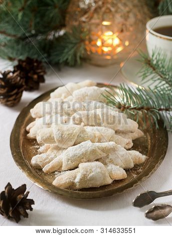 Traditional Moldavian Shortcake Cookies With Jam Stuffing And A Cup Of Tea On The Background Of Wint