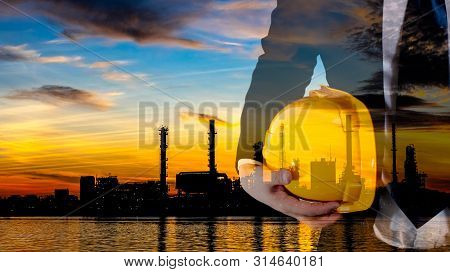 Double Exposure Of Engineer With Safety Yellow Helmet For Workers Security And Black And White Oil R