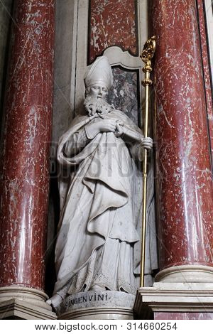 BRESSANONE, ITALY - JULY 14, 2018: Saint Ingenuinus statue on the Cassian altar in the Cathedral of Santa Maria Assunta i San Cassiano in Bressanone, Italy