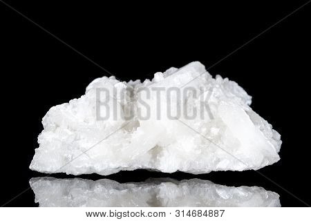 Raw White Stilbite Or Desmine Mineral Stone In Front Of Black Background, Mineralogy And Esotericism