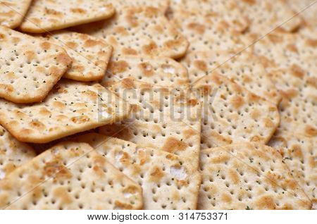 Tuc Original Snack Crackers Lies On Market Table Stacked In Big Pile