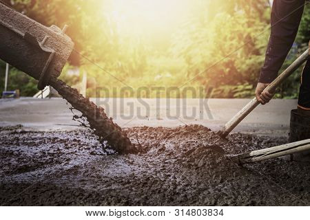 Contractors And Laborers Are Pouring Cement Floors