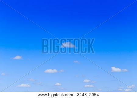 Blue Sky Background And White Clouds In Sunny Day
