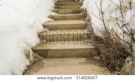 Panorama Weathered Concerete Outdoor Steps Amid Snow Covered Slope In Winter