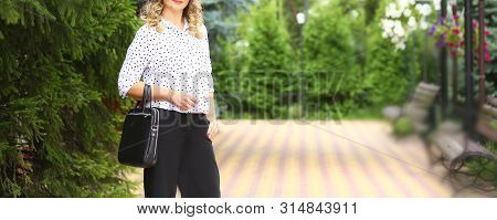 Stylish Business Woman Outdoors In Summer 
With Little Arm