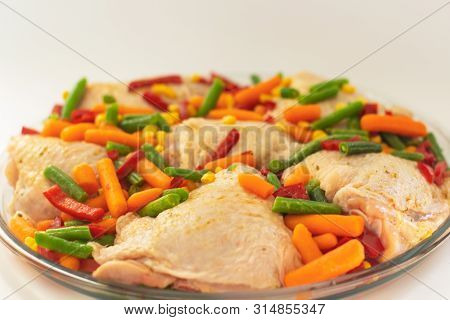 Bits Of The Raw Chicken With Vegetables. Сhicken Thighs With Pepper, Baby Carrot, Green Beans And Sp