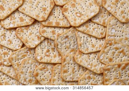 Tuc Original Snack Crackers Lies On Market Table Stacked In Big Pile