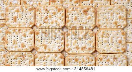 Tuc Original Snack Crackers Lies On Market Table Stacked In Big Pile