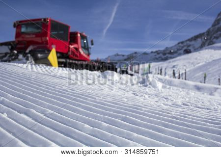 Snowplow Clears Tracks In The Ski Resort Of The Hintertuxer In Tyrol, Austria
