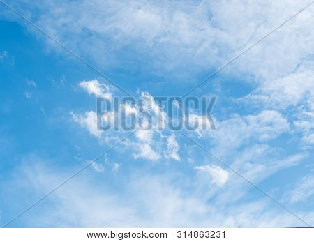 Pluffy Cloud Is Floating On The Blue Sky With The Copy Space.