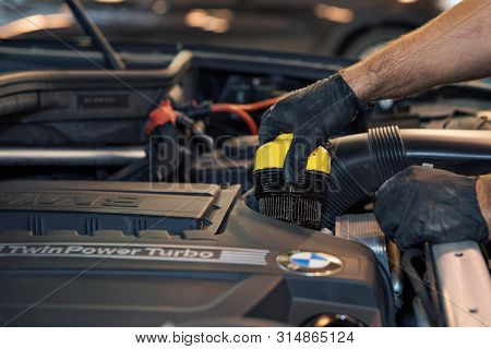 Advertising Car Wash, Moscow, 1.11.2018: Surface Cleaning. Bmw Motor Company Badge In Front Of Black
