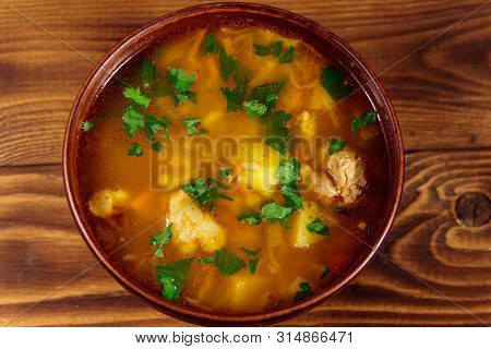 Kharcho Soup With Meat And Rice On Wooden Table. Top View