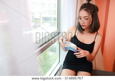 Portrait Of Beautiful And Sexy Asian Woman Reading A Book For Her Knowledge