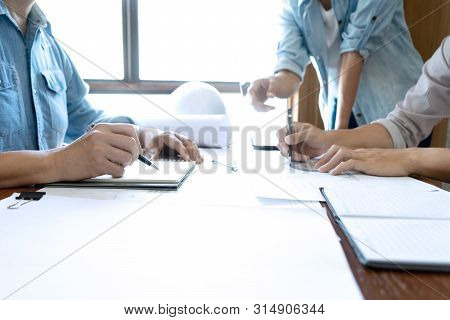 Group Of Engineering Or Architect Discussing
