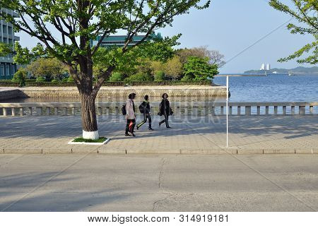 North Korea, Wonsan - May 3, 2019:  Children Go On The Promenade Of The Japanese Or Eastern Sea In W