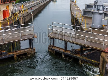 Lock Gate Opening In Ballard Locks Near Seattle, Washington