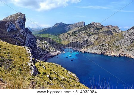 Sea Bay With Turquoise Water, Beach And Mountains, Cala Figuera On Cap Formentor