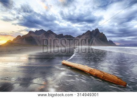 Dramatic Sunset Scene On Stokksnes Cape In Iceland. Location: Stokksnes Cape, Vestrahorn (batman Mou