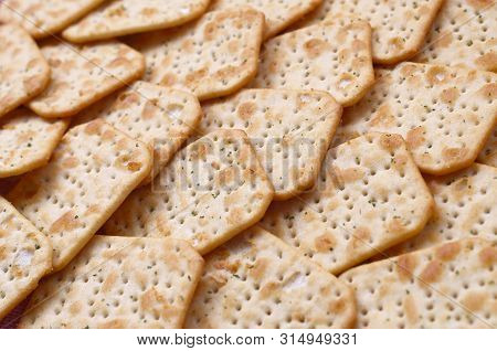 Tuc Original Snack Crackers Lies On Market Table Stacked In Big Pile