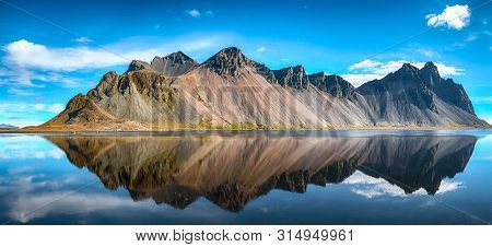 Splendid Sunny Day And Gorgeous Reflection Of Vestrahorn Mountaine On Stokksnes Cape In Iceland. Loc