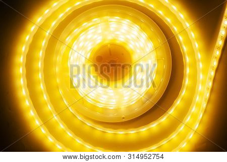 Bright Yellow Led Strip, Diode Strip, A Coil  Of Silicone Strip Close-up