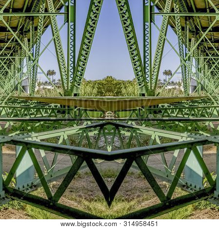 Square Frame Symmetrical Design Created From Doubling A Photo Of A Green Bridge In California