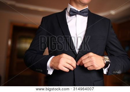 Sharp Dressed Man Wearing Jacket And Bow Tie