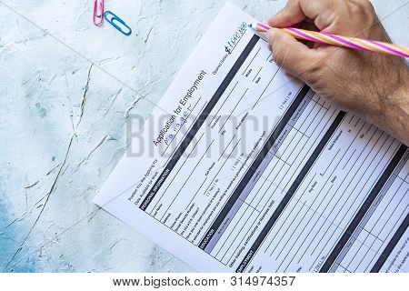 Hand Filling Standard Application For Employment. Hr, Hiring, Applicant Filling Job Application. Hr,