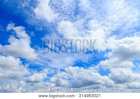 Blue Sky Background And White Clouds In Sunny Day