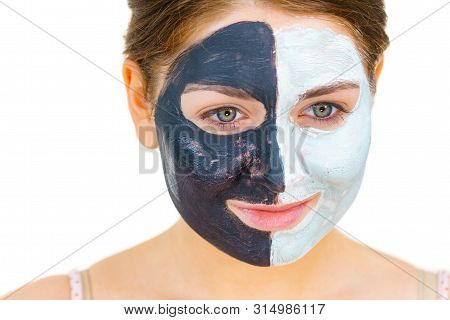 Girl With Black White Mud Mask On Face