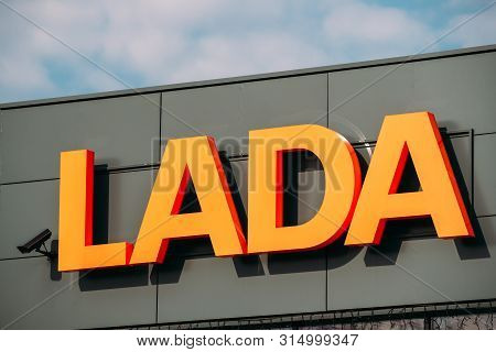 Gomel, Belarus - April 8, 2019: Close View Of Logotype Lada At Wall Of Store In Car Showroom. The La