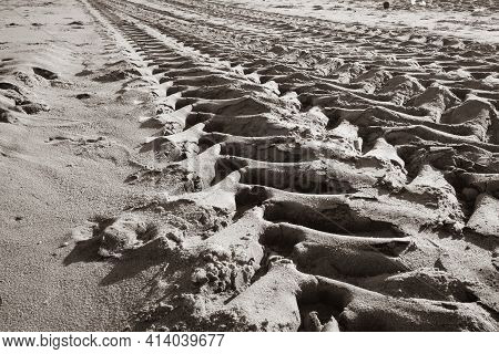 Tractor Tire Marks Over The Beach Sand In Mahabalipuram. Tyre Impression Of A Vehicle.