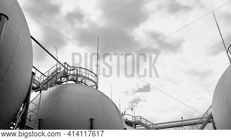 Industrial Landscape Bottom Up View On Several Spherical Gasholders With Lightning Protection And Sa