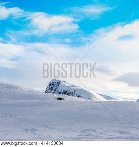 Mount Bitihorn In Beitostølen, Norway On A Cold Clear And Snowy Winters Day.