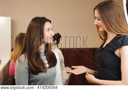 Make Up Artist Doing Professional Make Up Of Young Woman. Beauty Shcool.